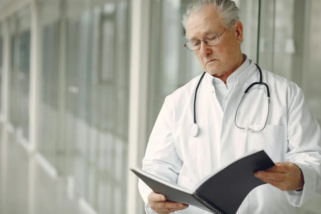 Clinician carefully reviewing patient documentation for accuracy