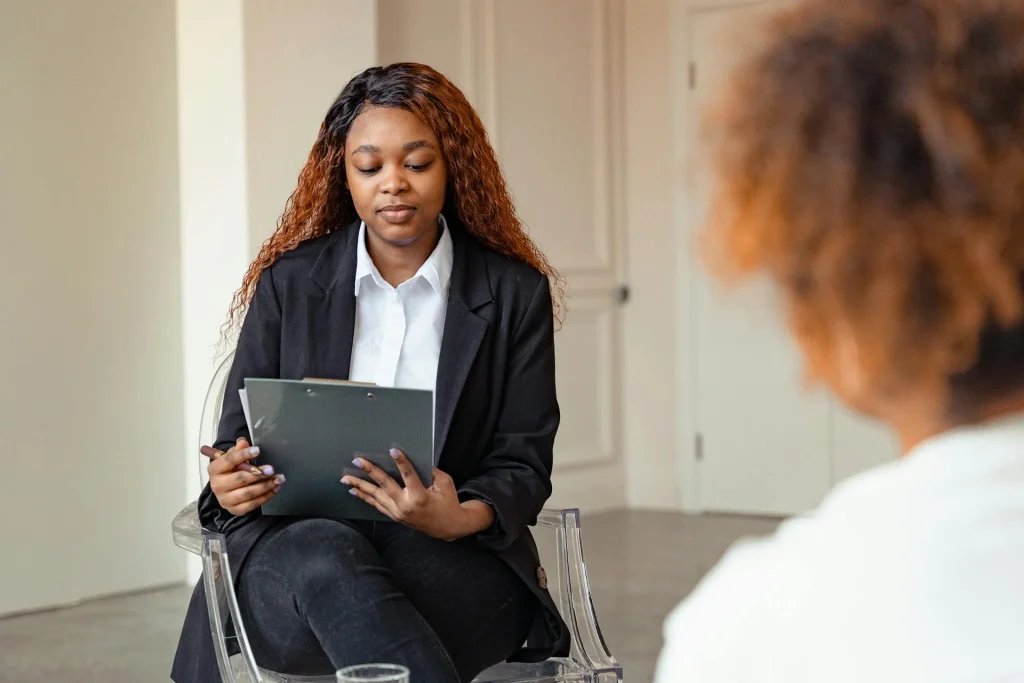 Clinician reviewing documents on a desk