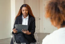Clinician reviewing a mental status exam template on paper