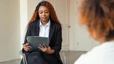 Clinician reviewing a mental status exam template on paper