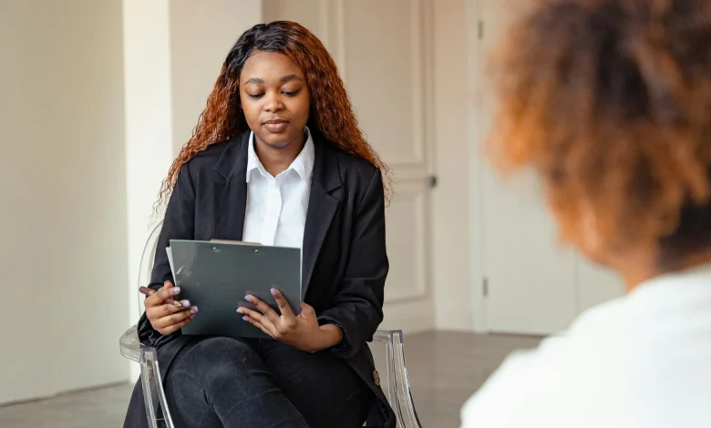 Clinician reviewing a mental status exam template on paper